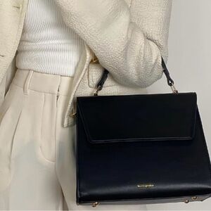 Kate Spade Black Leather Satchel with Structured Design